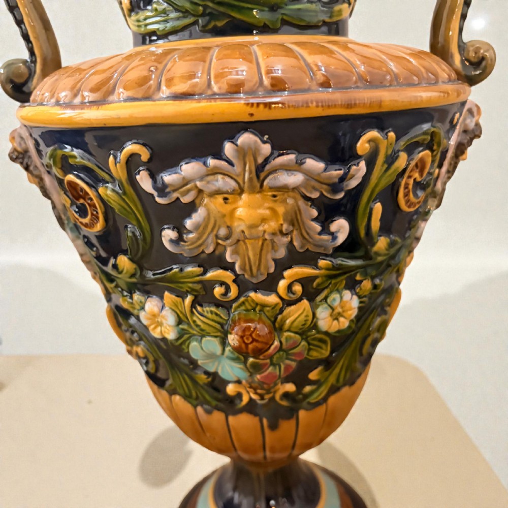 Pair of 19th-century Renaissance Revival majolica ceramic urns with dragon handles, mascaron reliefs, and polychrome glazes. View III