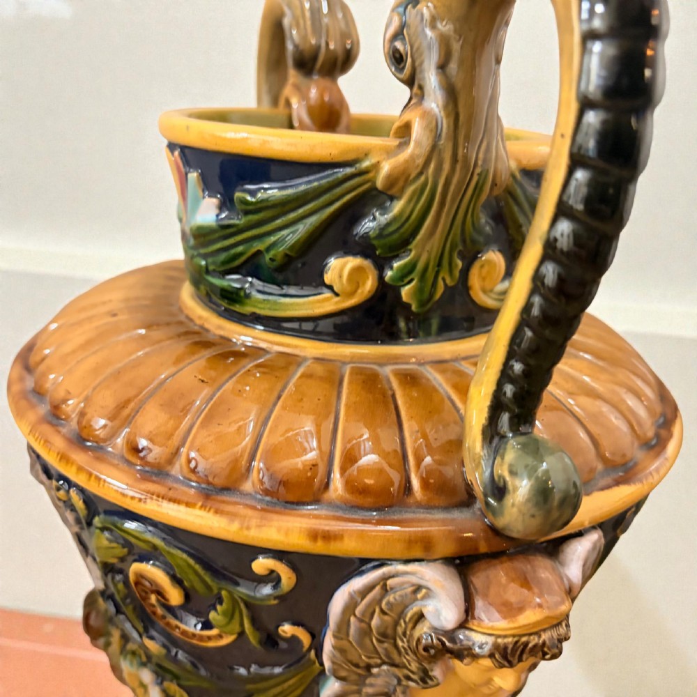 Pair of 19th-century Renaissance Revival majolica ceramic urns with dragon handles, mascaron reliefs, and polychrome glazes. View VI
