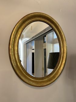 MID 19TH CENTURY FRENCH OVAL MIRROR WITH WIDE ETCHED GILT FRAME