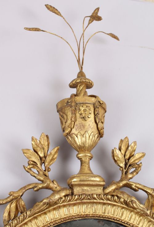 fig 1. George III period carved and gilt wood wall mirror in the neo-classical style
