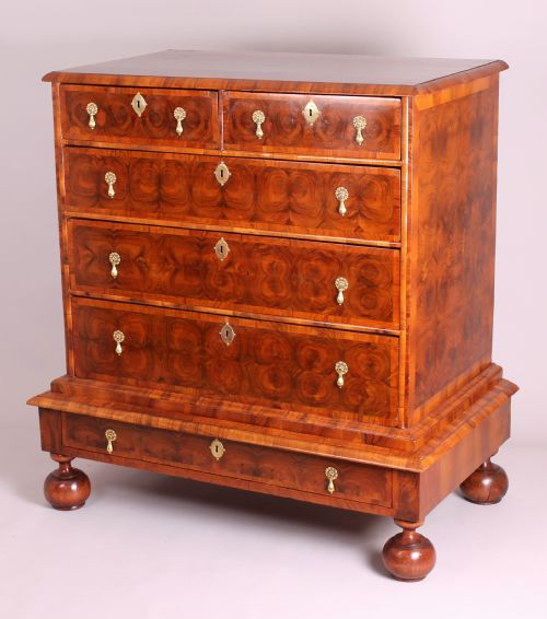 A Fine and Rare Walnut Oyster-piece Chest-on-stand