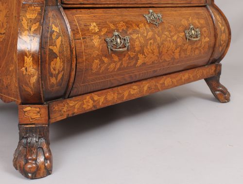fig 1. Eighteenth century Dutch walnut and marquetry chest-of-drawers of bold bombe form