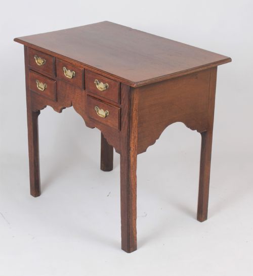 fig 1. George II oak lowboy; the top with a moulded edge