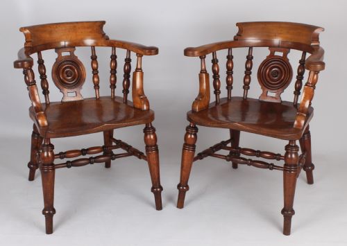 AN EXCEPTIONAL PAIR OF MID19TH CENTURY SMOKERS BOW ARMCHAIRS IN SATIN BIRCH