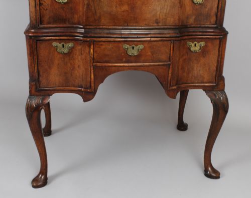 fig 1. Queen Anne revival walnut chest on stand with a shaped front
