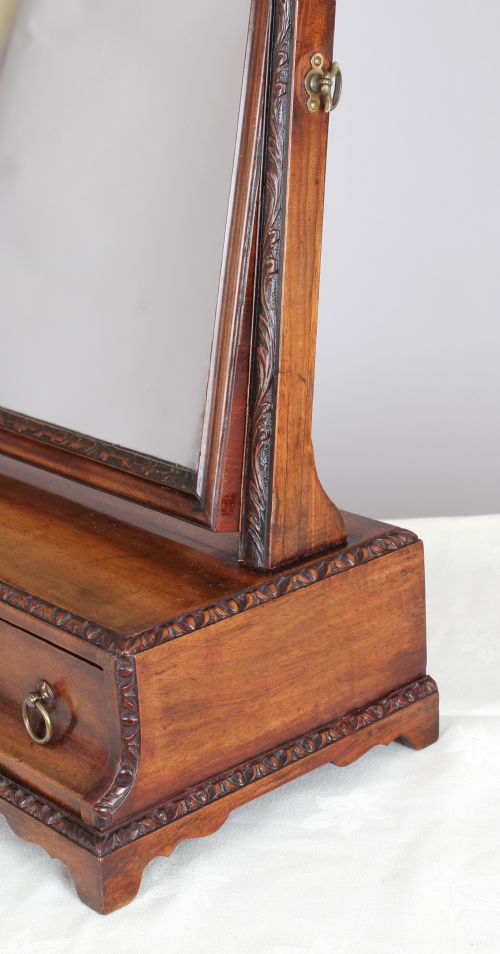 fig 1. A mahogany dressing table toilet mirror with exceptional carved detail;