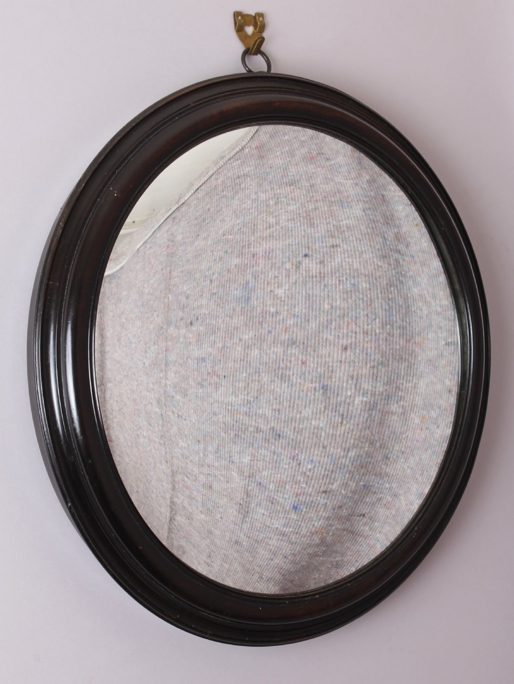 William IV Period Small Convex Mirror in a Moulded Ebony Frame