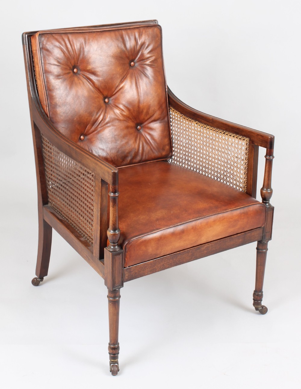 Late nineteenth century mahogany library bergere in the Regency style