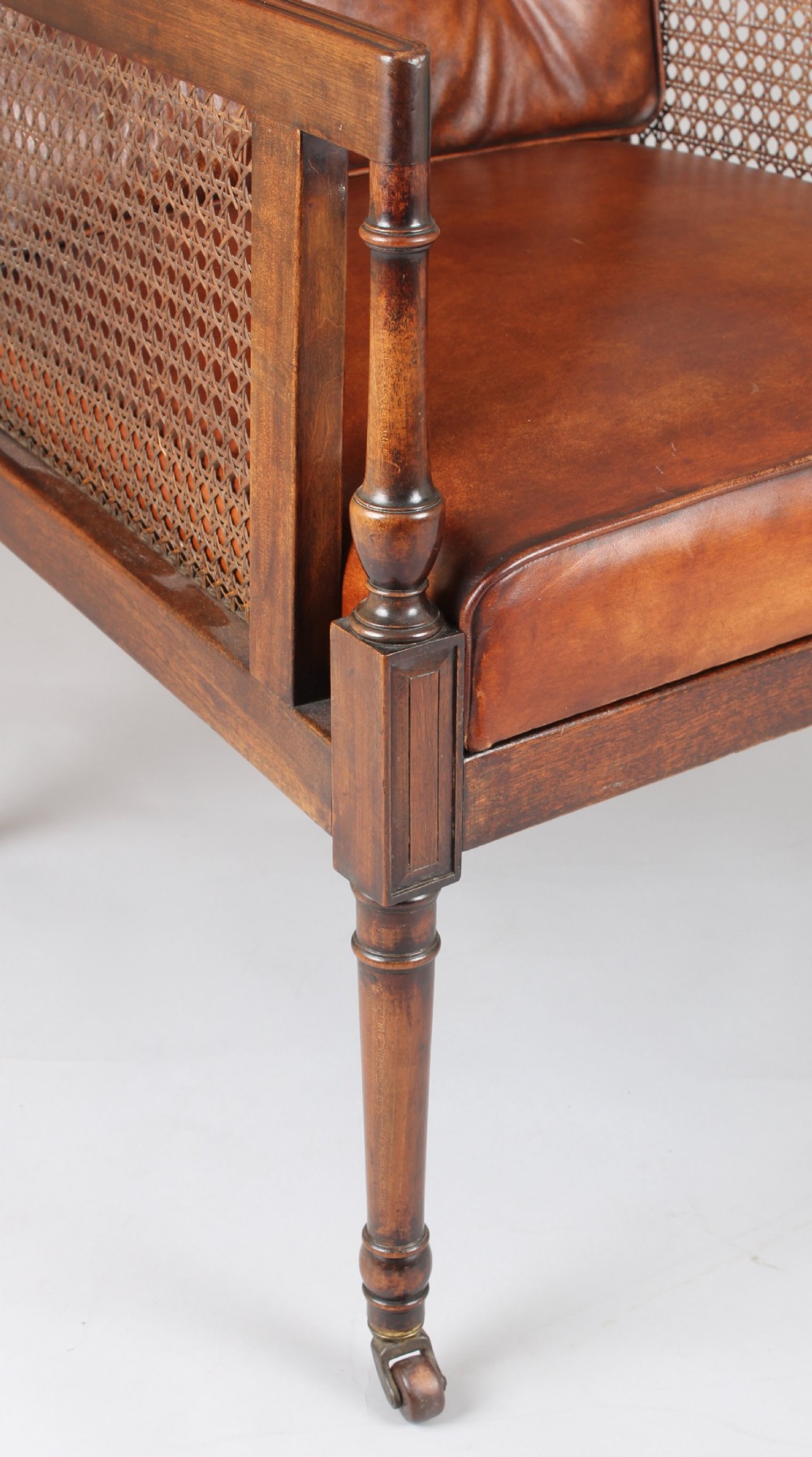 Late nineteenth century mahogany library bergere in the Regency style View II