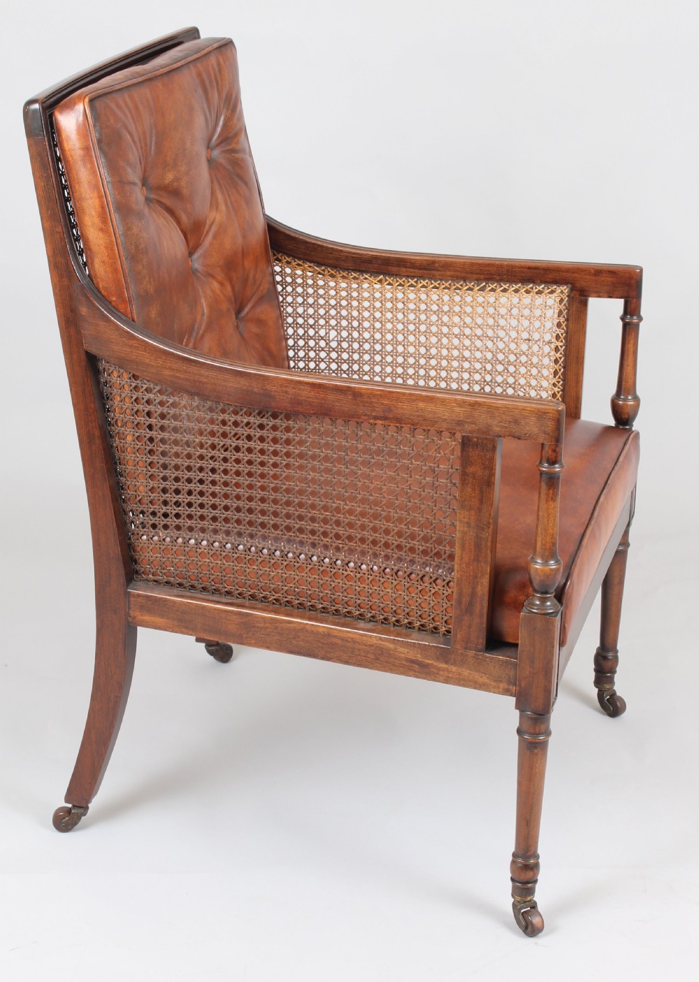Late nineteenth century mahogany library bergere in the Regency style View III