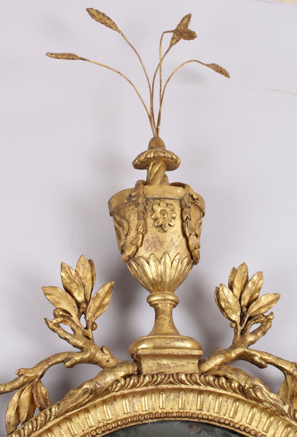 George III period carved and gilt wood wall mirror in the neo-classical style View II