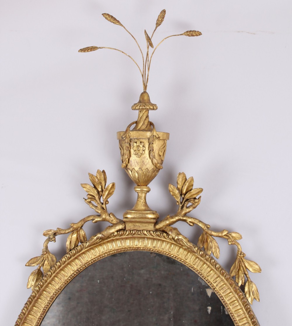 George III period carved and gilt wood wall mirror in the neo-classical style View III