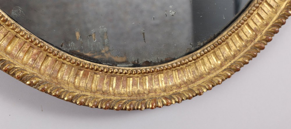 George III period carved and gilt wood wall mirror in the neo-classical style View IV