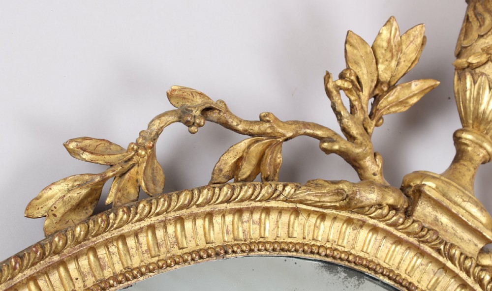 George III period carved and gilt wood wall mirror in the neo-classical style View V