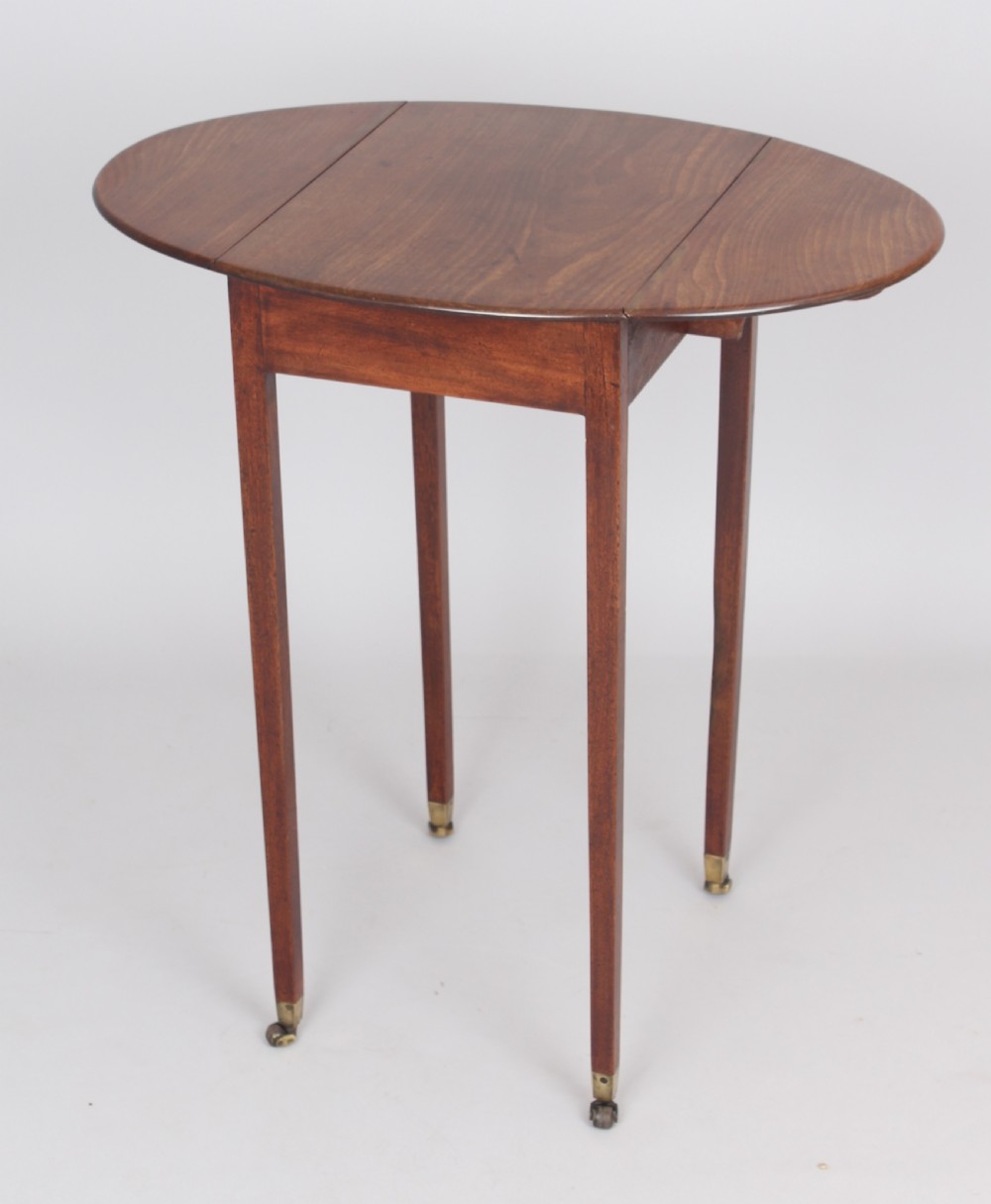 George III period mahogany small oval Pembroke table of simple design 