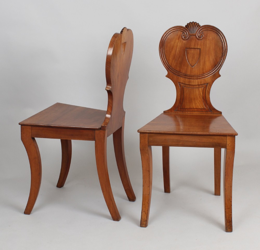 Pair of Regency period pale mahogany hall-chairs View II