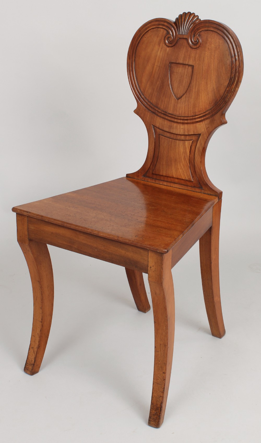 Pair of Regency period pale mahogany hall-chairs View III