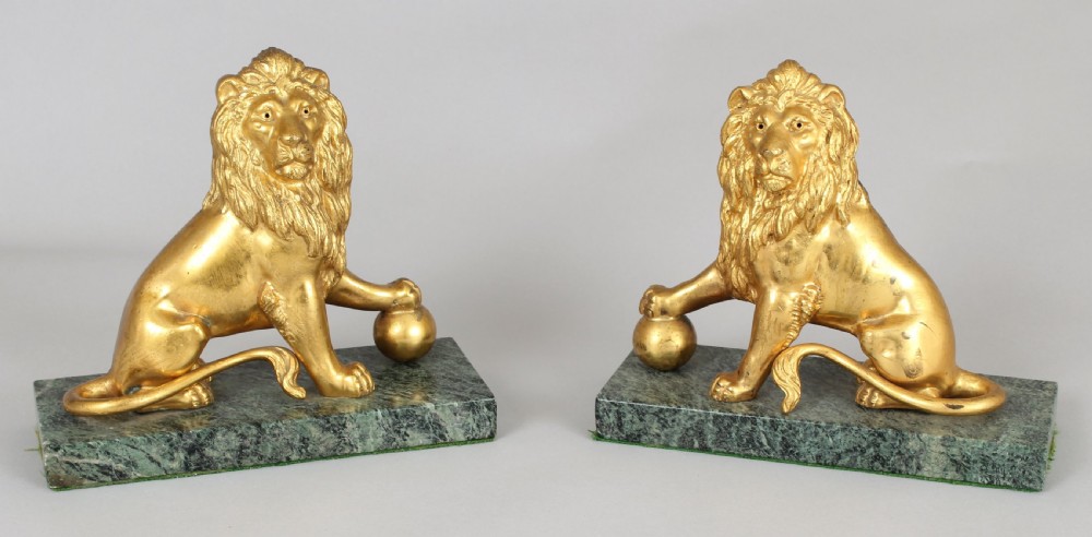 Pair of mid 19th century cast and chased ormolu figures of lions