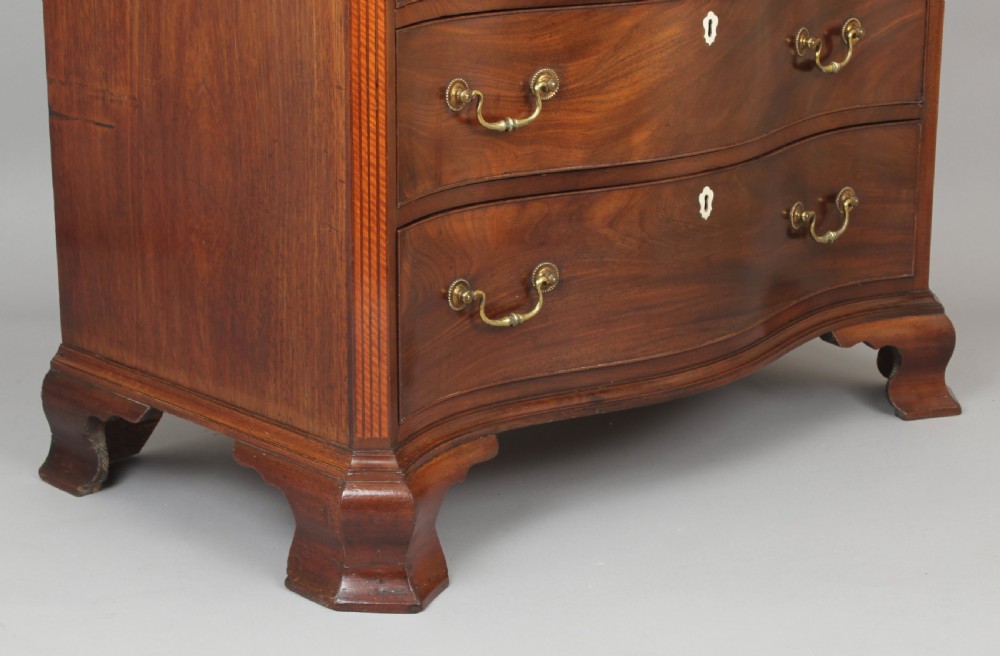 Fine George III period mahogany serpentine dressing-chest of small proportions View II