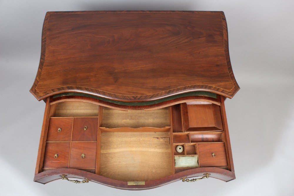 Fine George III period mahogany serpentine dressing-chest of small proportions View IV
