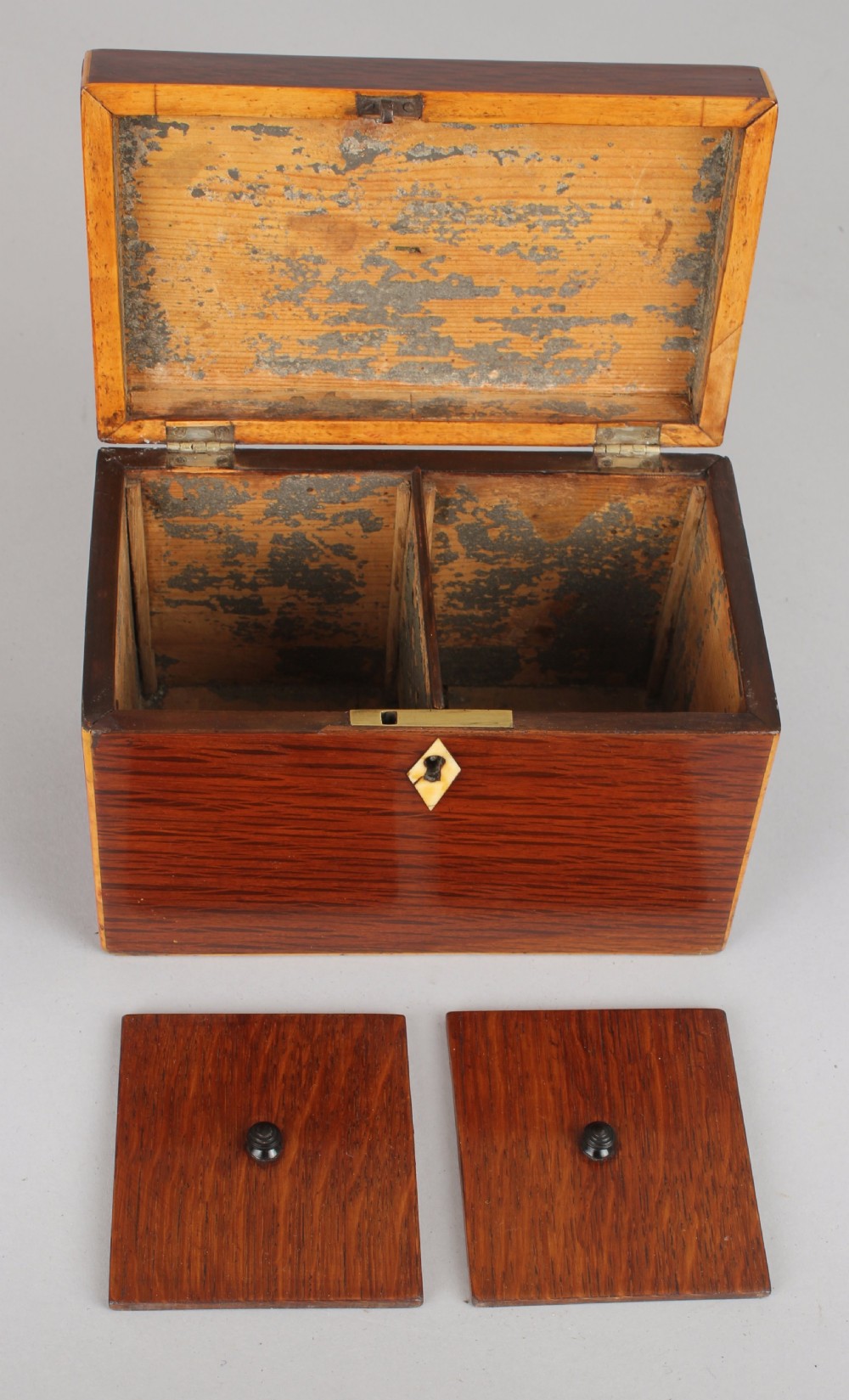 A rectangular George III partridge-wood tea caddy featuring dark dappled grain, boxwood stringing, a silver top plaque, and a diamond bone escutcheon. View II