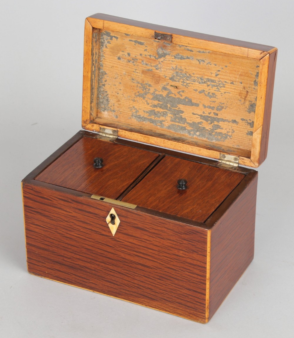 A rectangular George III partridge-wood tea caddy featuring dark dappled grain, boxwood stringing, a silver top plaque, and a diamond bone escutcheon. View III