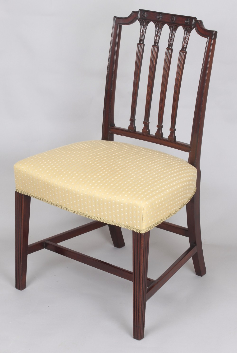 A set of six fine George III period mahogany dining-chairs in the Hepplewhite style