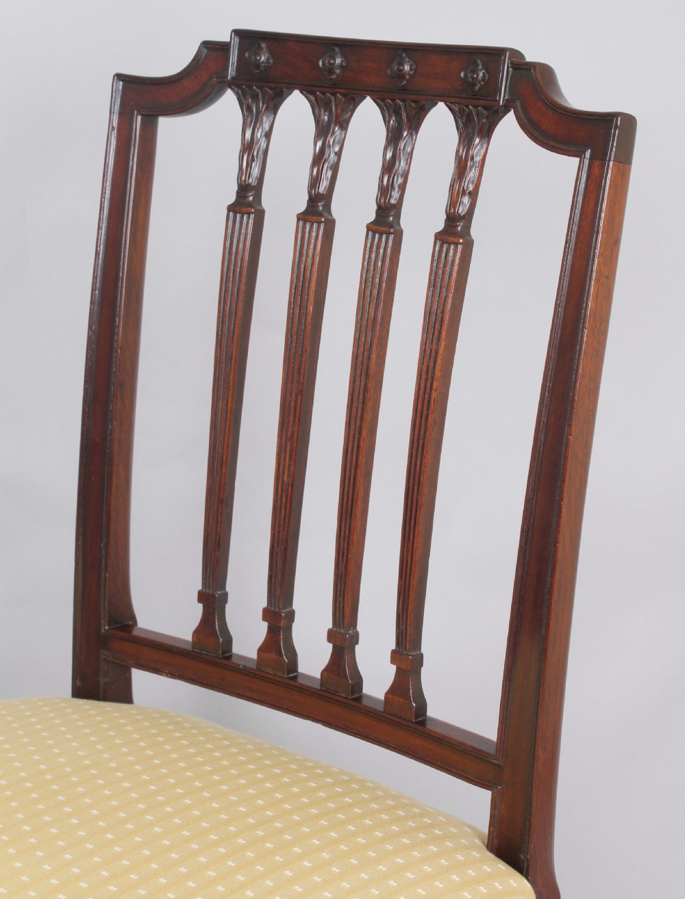 A set of six fine George III period mahogany dining-chairs in the Hepplewhite style View IV