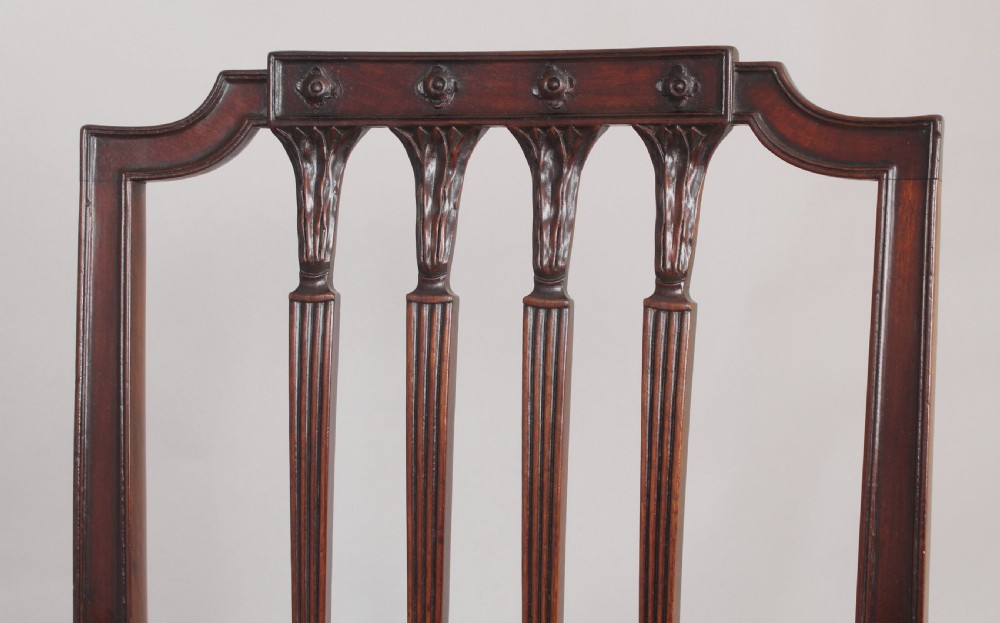A set of six fine George III period mahogany dining-chairs in the Hepplewhite style View V