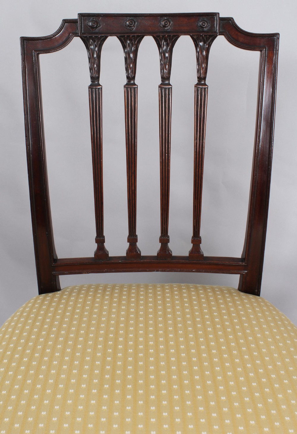 A set of six fine George III period mahogany dining-chairs in the Hepplewhite style View VI