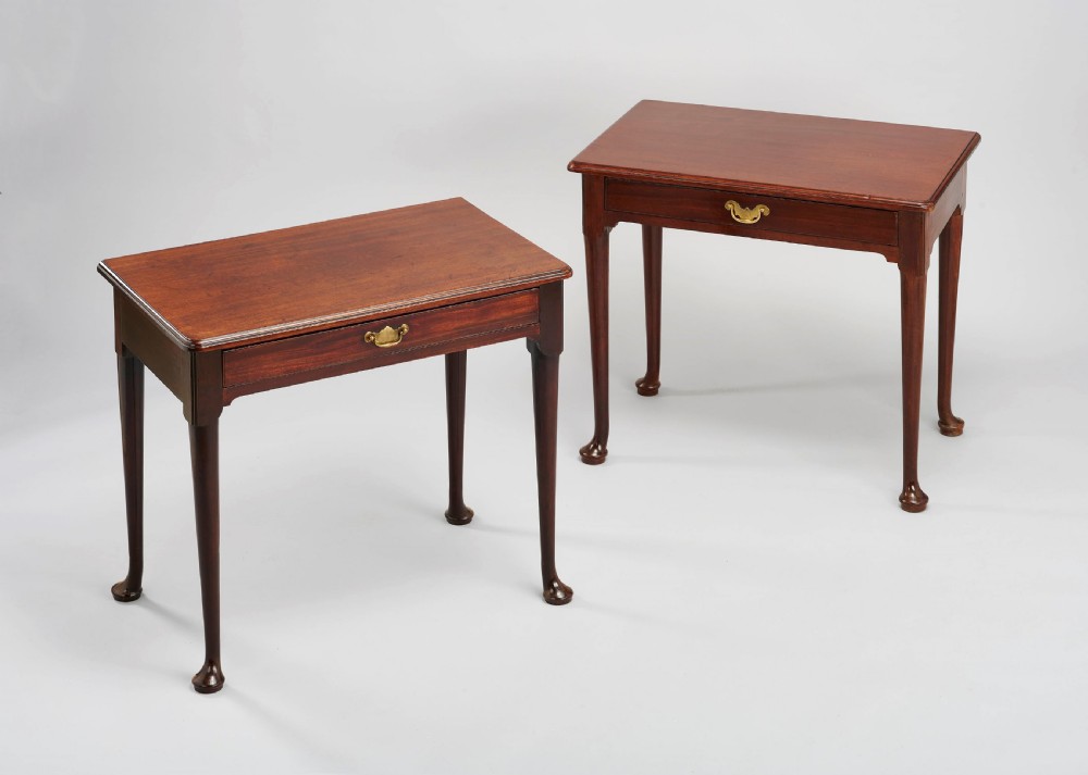 A matched pair of George II period 'red walnut' side-tables