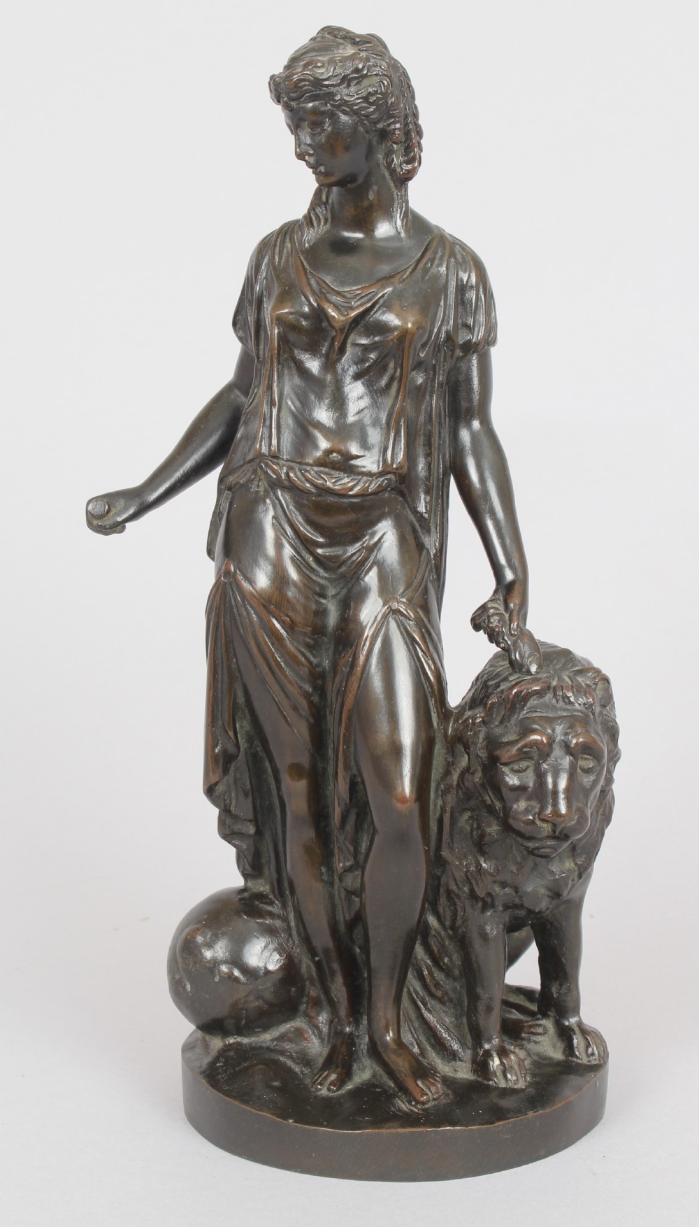 Bronze statuette of a classical woman and lion