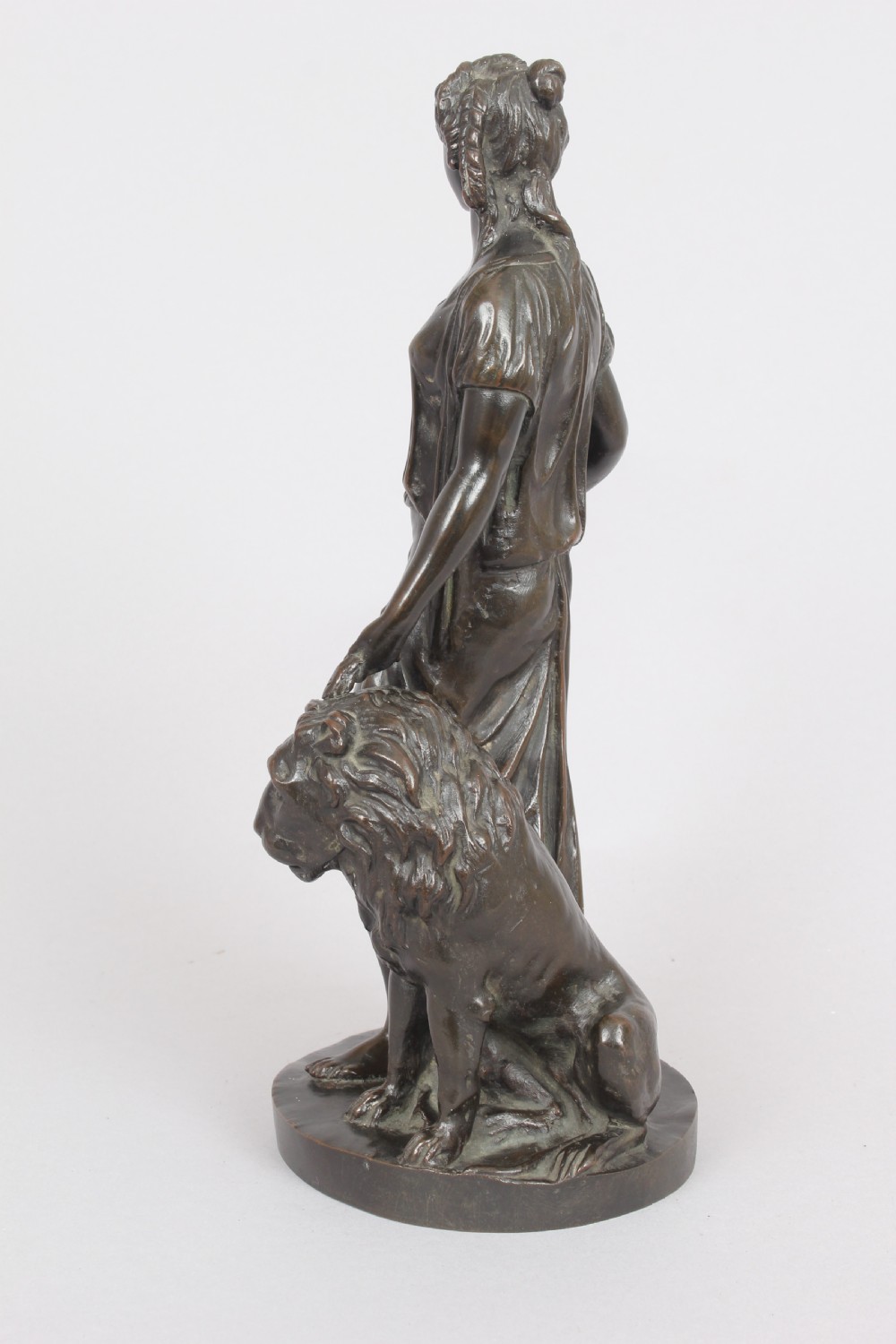 Bronze statuette of a classical woman and lion View V