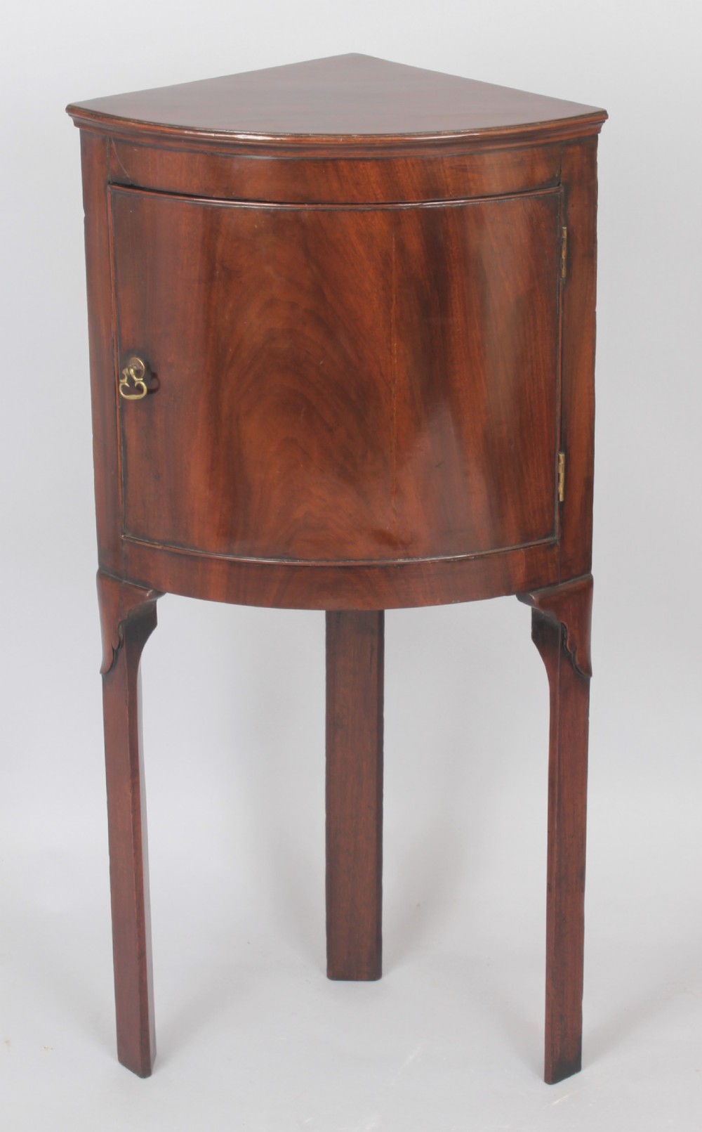 George III period mahogany bow-fronted corner cupboard