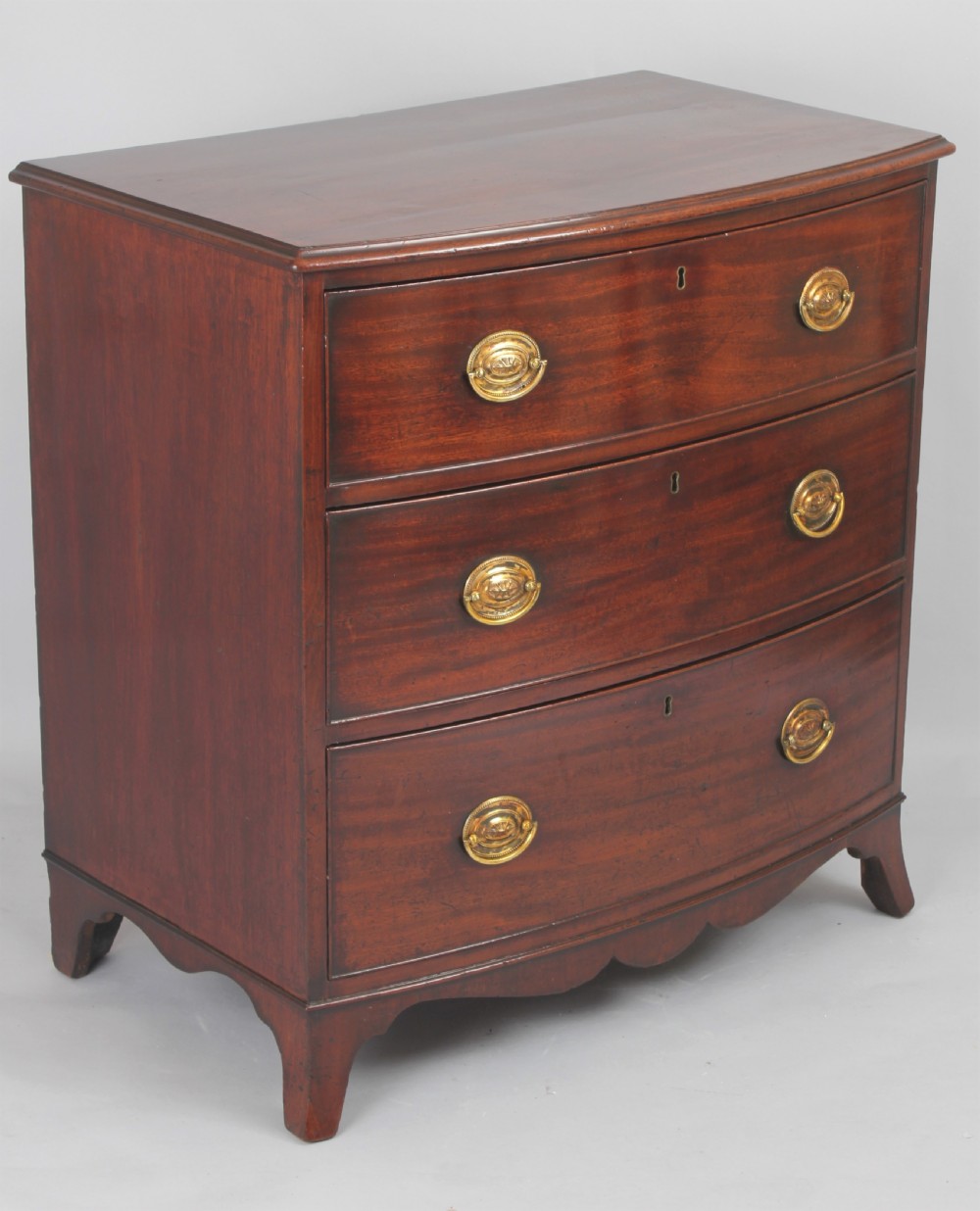Good quality George III period mahogany small bow fronted chest of drawers View II