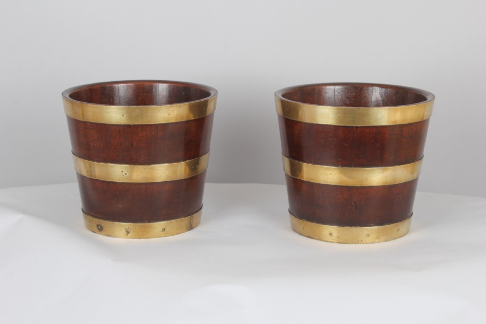 Pair of George III period mahogany and brass banded tubs