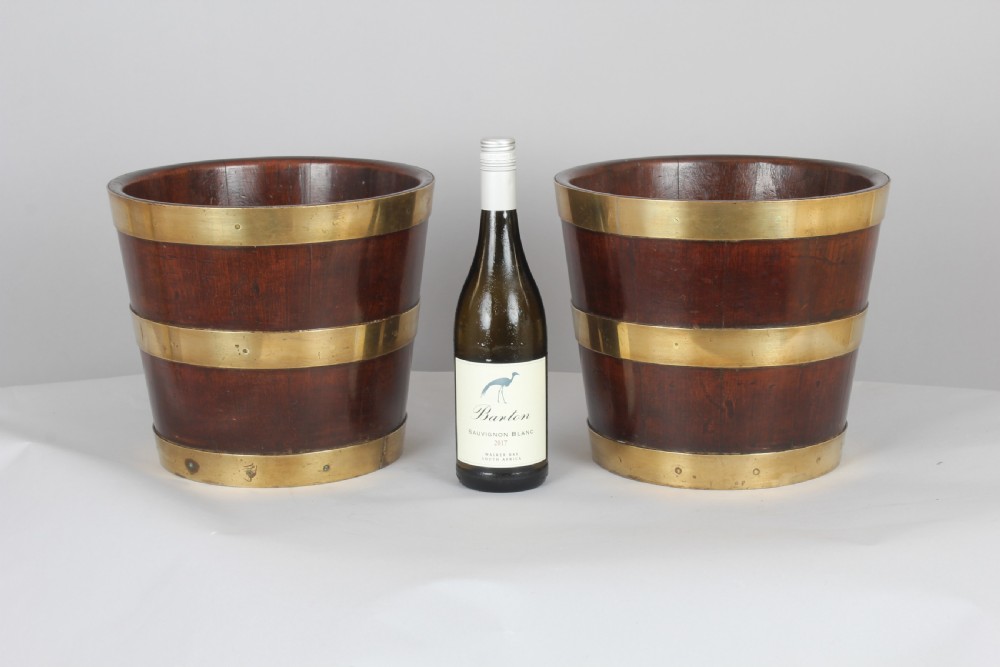 Pair of George III period mahogany and brass banded tubs View II