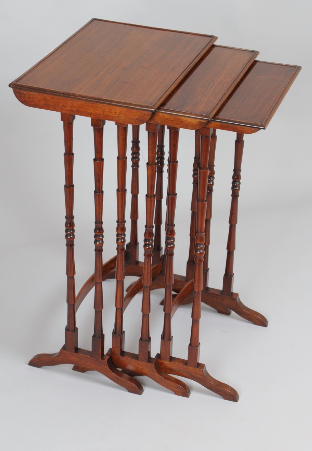 Nest of three tables in rosewood