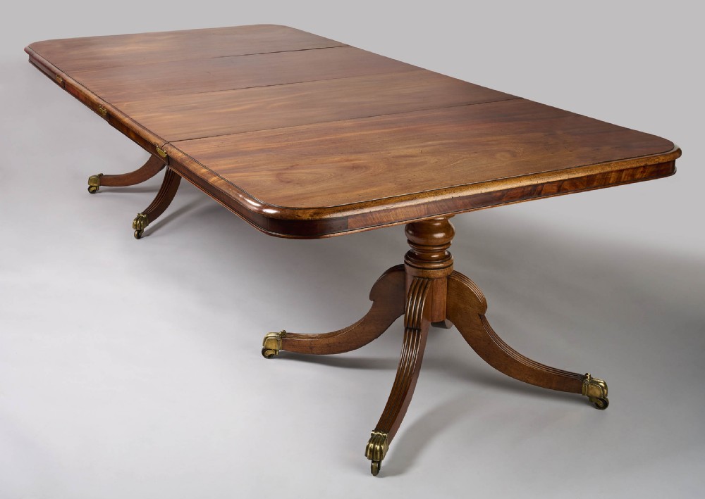 A fine George III period mahogany twin pillar dining table View IV