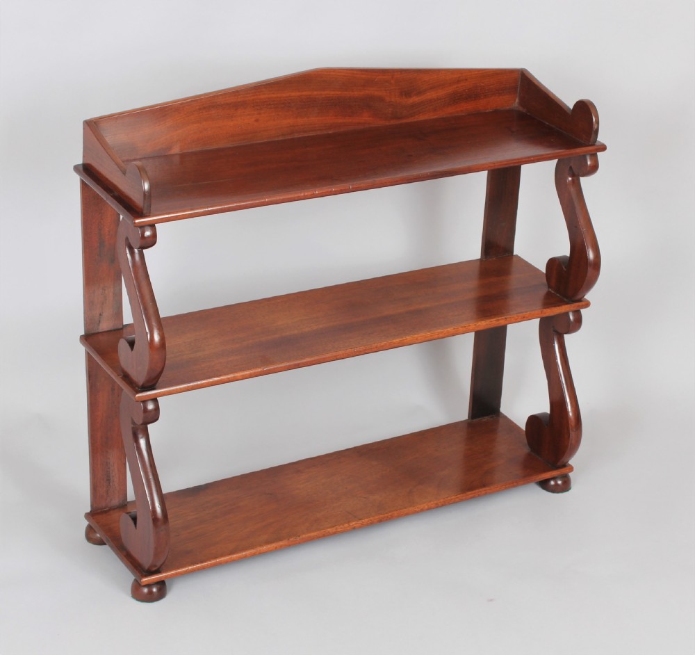 A Regency set of mahogany hanging shelves View IV