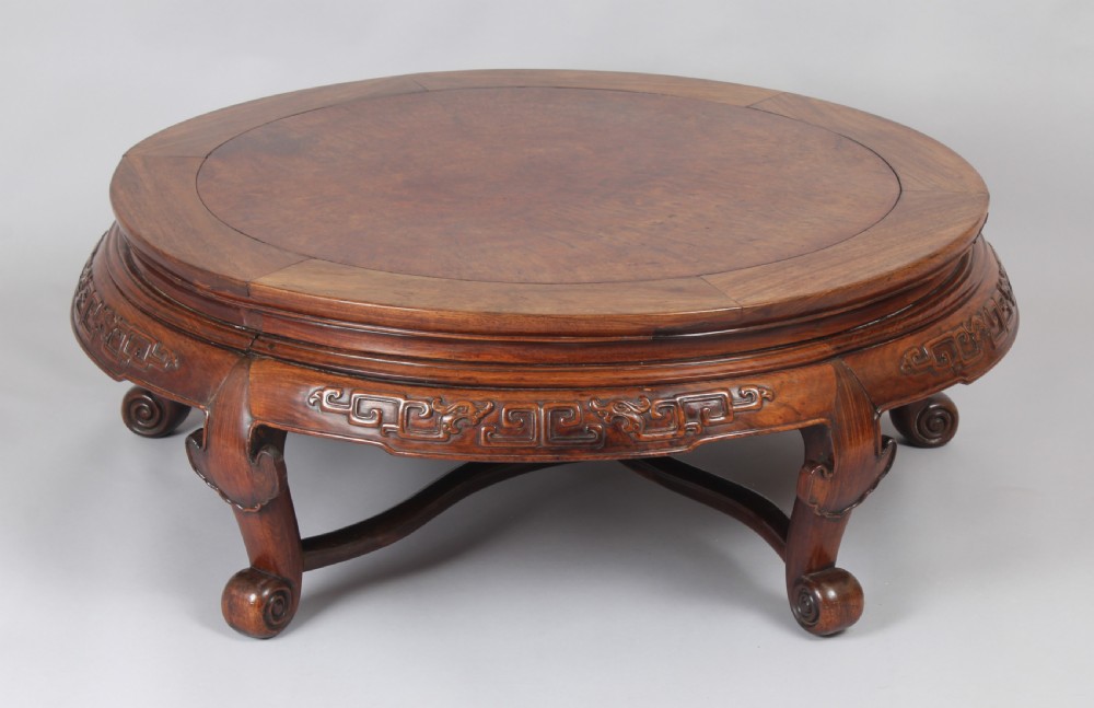 A 19th century Chinese hardwood circular 'Opium' table