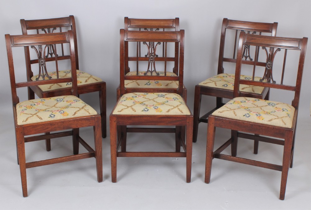 A set of six charming George III mahogany single dining chairs