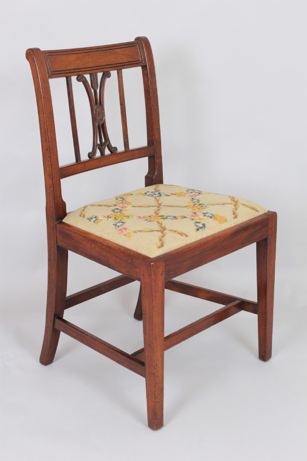A set of six charming George III mahogany single dining chairs View II