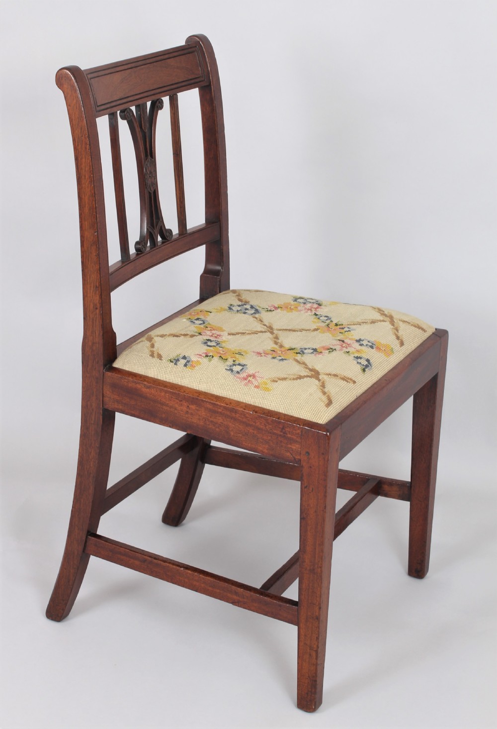 A set of six charming George III mahogany single dining chairs View IV