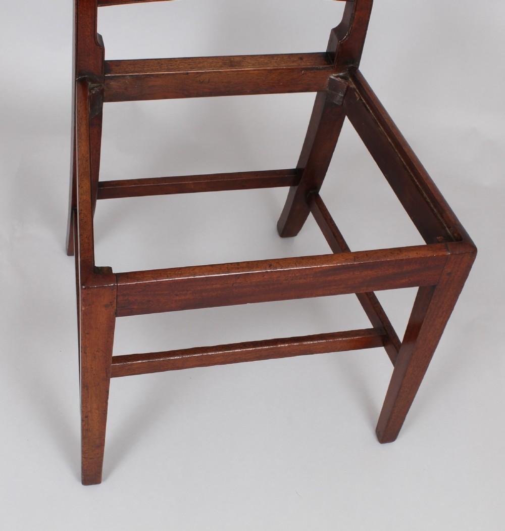 A set of six charming George III mahogany single dining chairs View V
