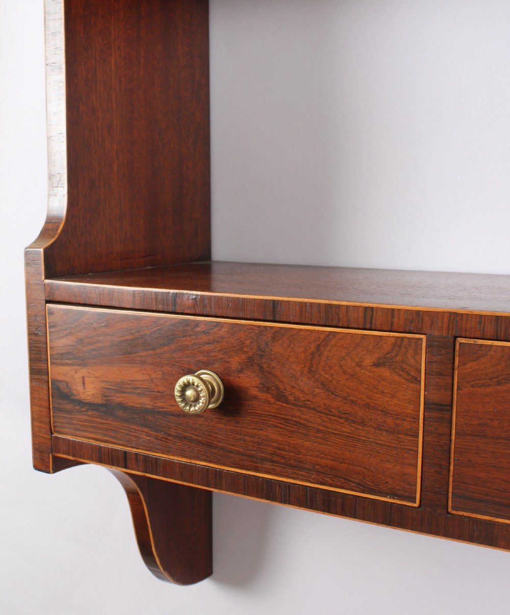Unusual George III period mahogany hanging shelves View III