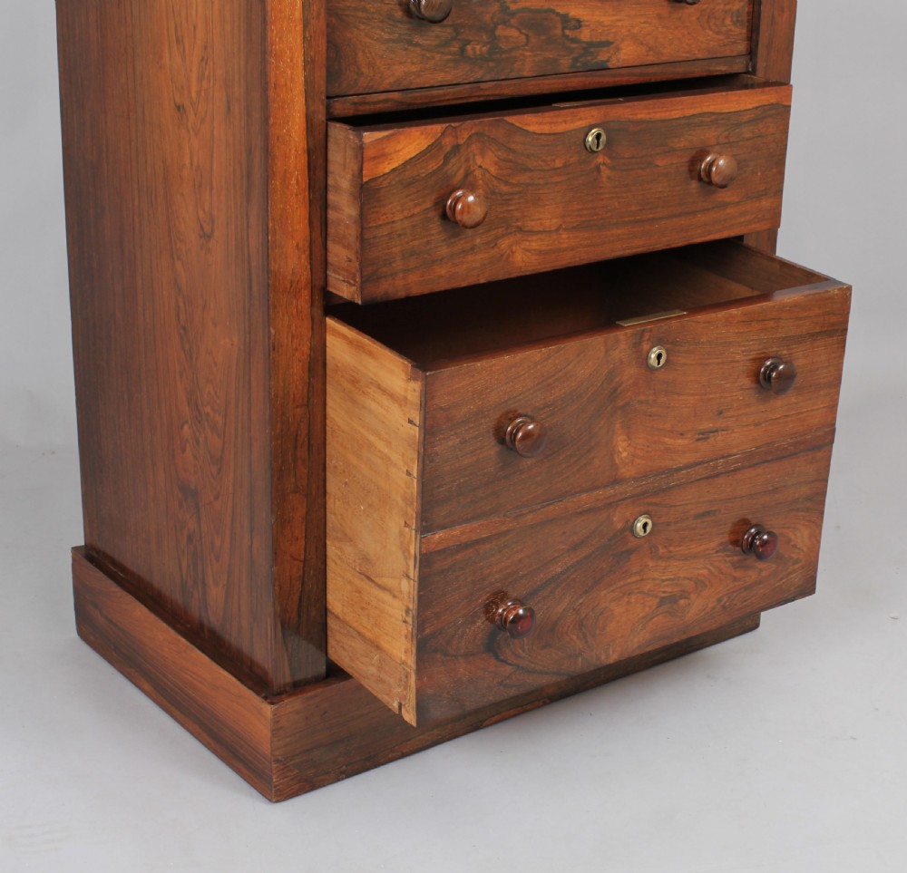 Well-figured and useful rosewood Wellington chest View II