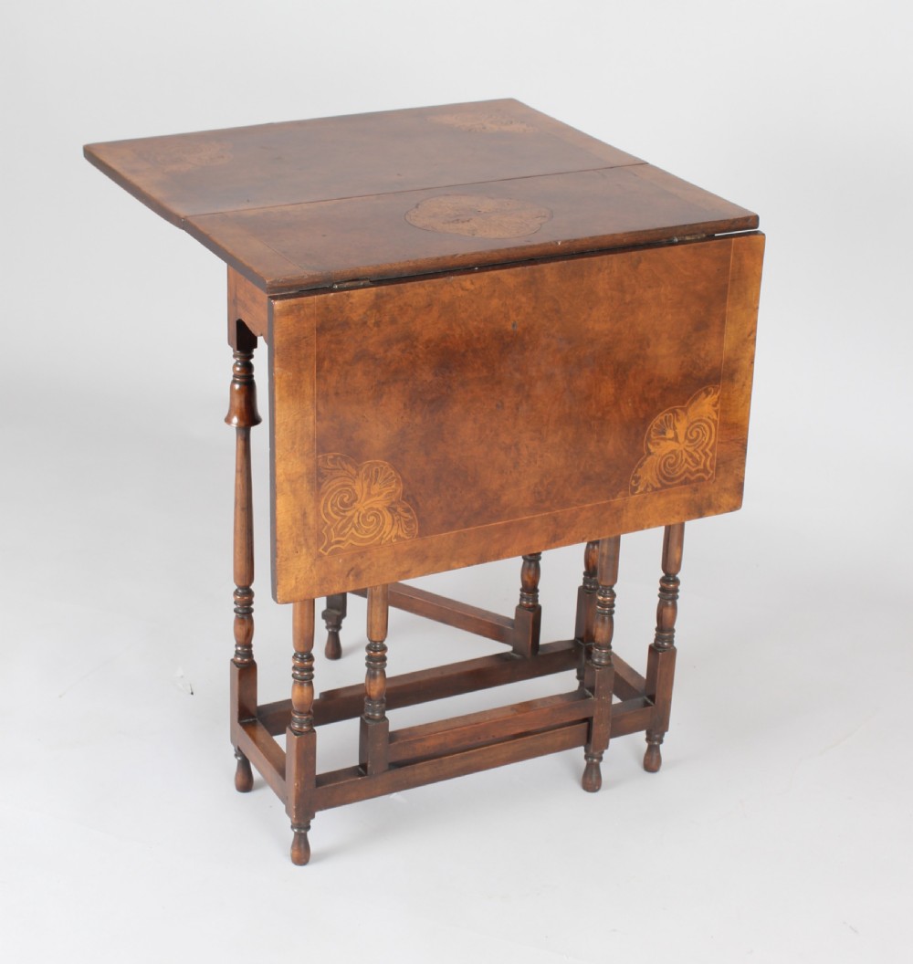Edwardian burr walnut and parquetry Sutherland table of rare form
