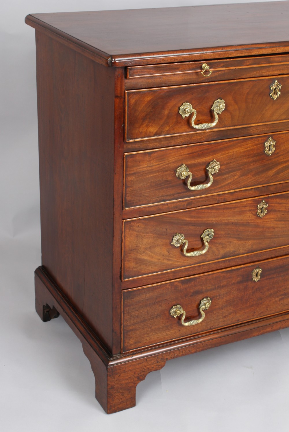 Small George III mahogany chest of four graduated drawers View III
