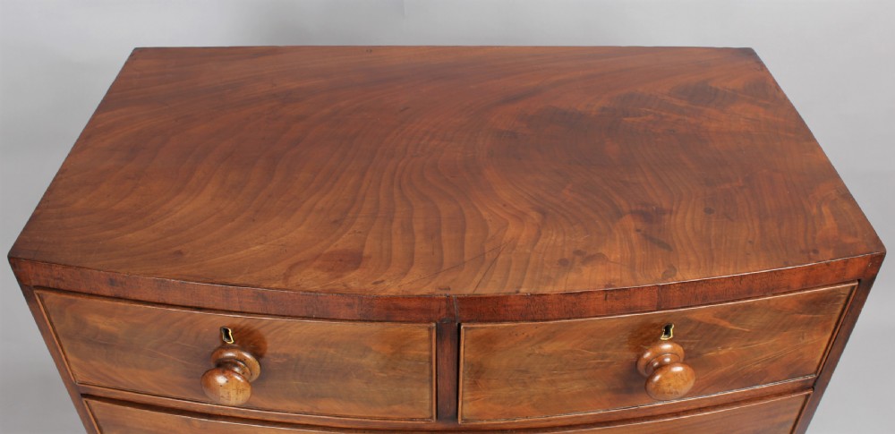 A small early Victorian bow-fronted mahogany chest of drawers View II